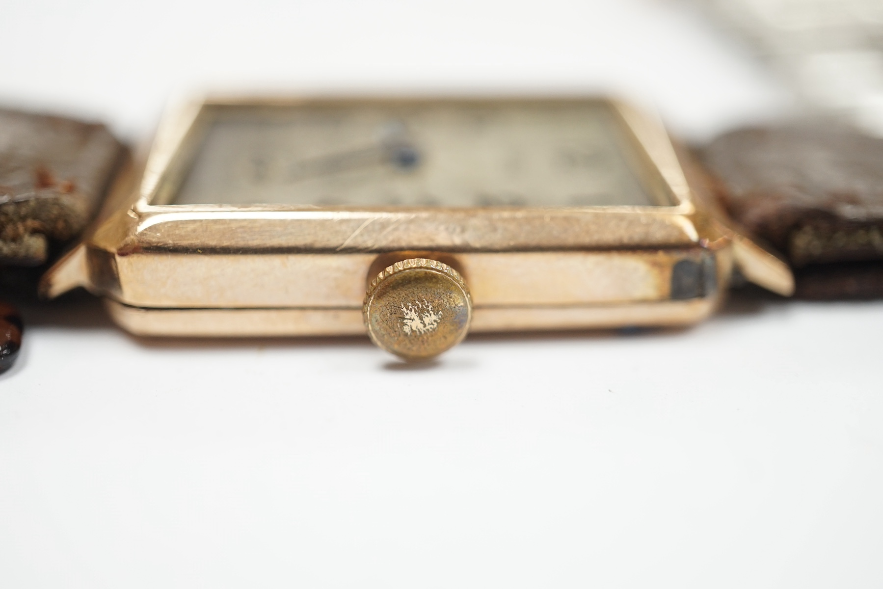 An early 20th century yellow metal and diamond cluster set bar brooch, 45mm, together with two 9ct gold cased manual wind wrist watches and assorted steel watch links. Condition - poor to fair